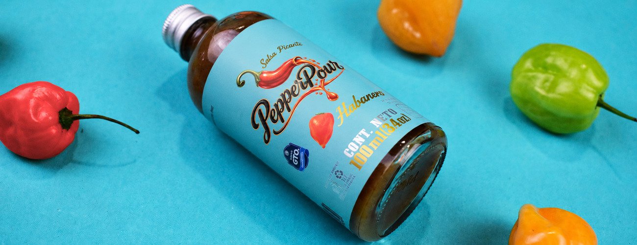 PepperPour roasted habanero hot sauce with colorful peppers